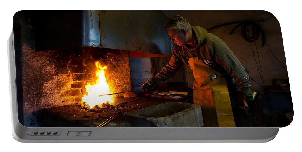 The Torresta Blacksmith Portable Battery Charger featuring the photograph The Torresta Blacksmith by Torbjorn Swenelius