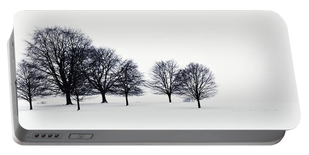 Rural Portable Battery Charger featuring the photograph Trees In A Snowy Field In Chatsworth by John Doornkamp