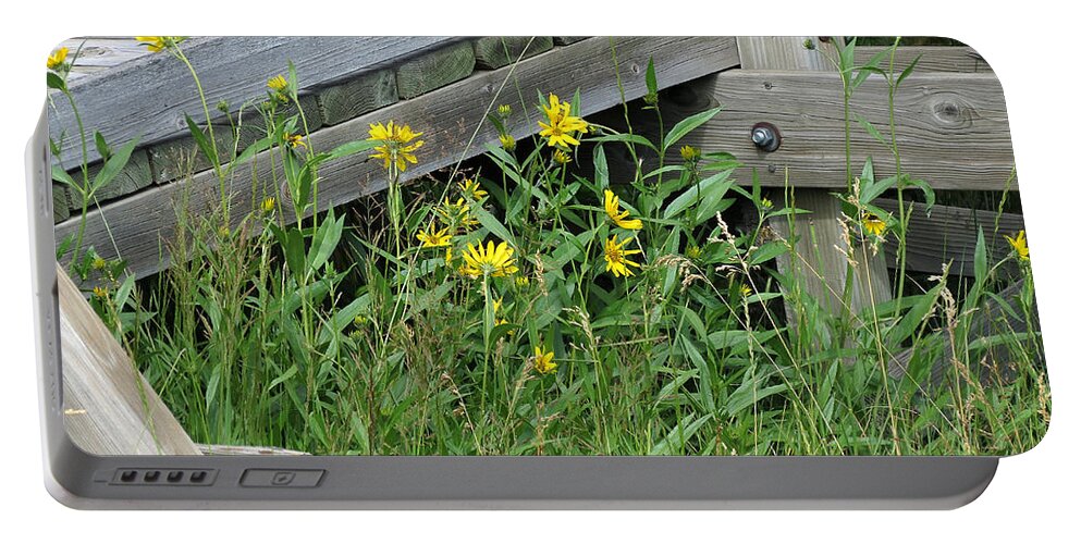 Yellow Flowers Portable Battery Charger featuring the photograph Under the Boardwalk by Laurel Powell
