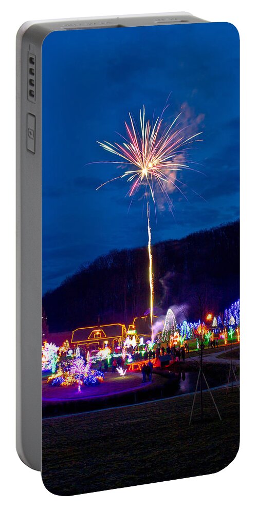 Christmas Portable Battery Charger featuring the photograph Village in Christmas lights fireworks by Brch Photography