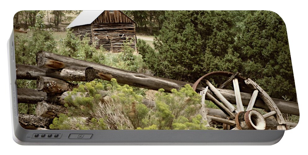 Cabin Portable Battery Charger featuring the photograph Wagon Wheel by KATIE Vigil