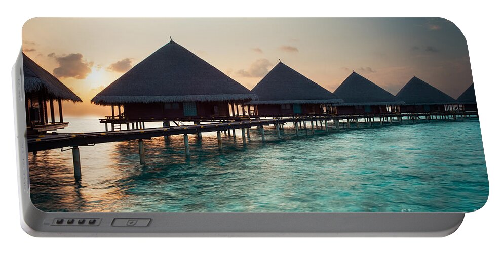 Amazing Portable Battery Charger featuring the photograph Waterbungalows At Sunset by Hannes Cmarits