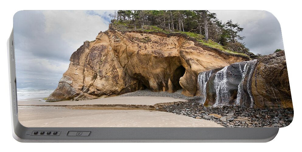 Beach Portable Battery Charger featuring the photograph Waterfall Flowing into the Pacific Ocean by Jeff Goulden