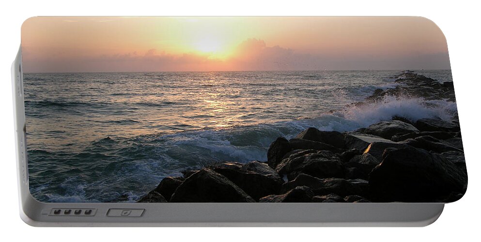 Rocks Portable Battery Charger featuring the photograph Waves on the jetty at sunrise by Julianne Felton