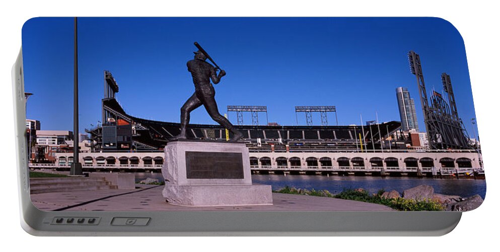 Photography Portable Battery Charger featuring the photograph Willie Mays Statue In Front by Panoramic Images