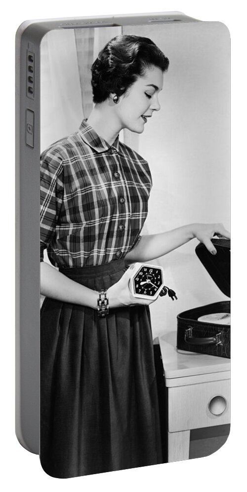 1035-509 Portable Battery Charger featuring the photograph Woman Packing A Suitcase by Underwood Archives