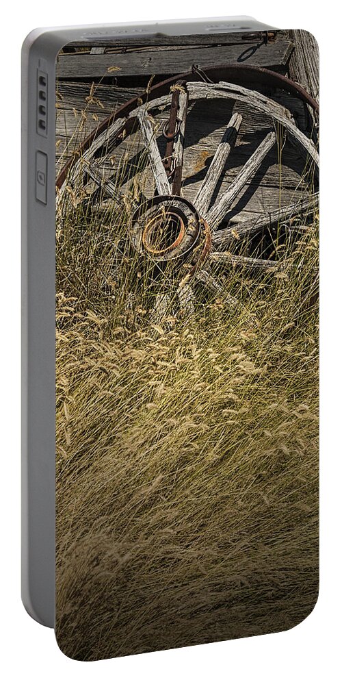 Art Portable Battery Charger featuring the photograph Wooden Wheel of a Broken Farm Wagon by Randall Nyhof
