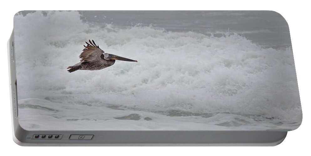 Pelican Portable Battery Charger featuring the photograph flying Pelican #2 by Ralf Kaiser