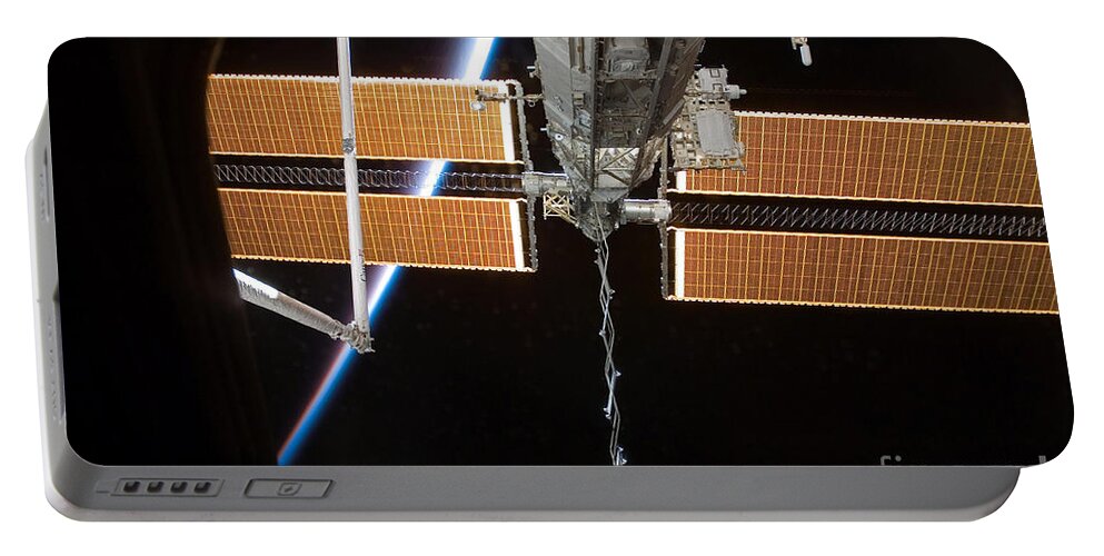Nasa Portable Battery Charger featuring the photograph Iss Solar Array #1 by Nasa