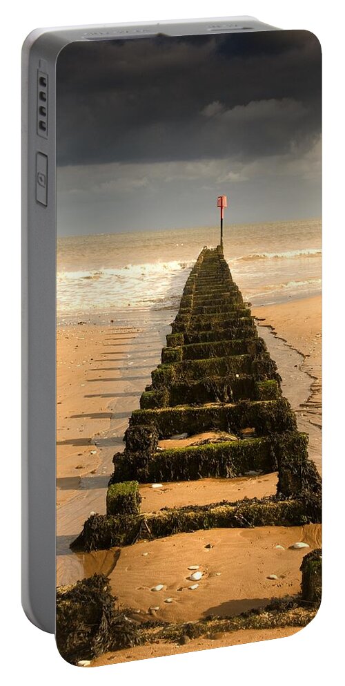 Atmospheric Portable Battery Charger featuring the photograph Jetty On Beach, Yorkshire, England #1 by John Short