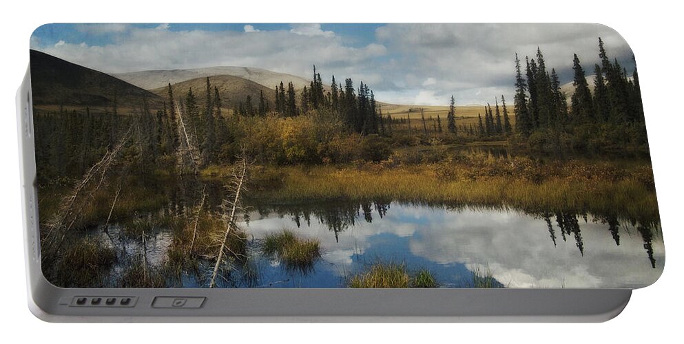 Dempster Portable Battery Charger featuring the photograph Blissful Lone Land by Priska Wettstein