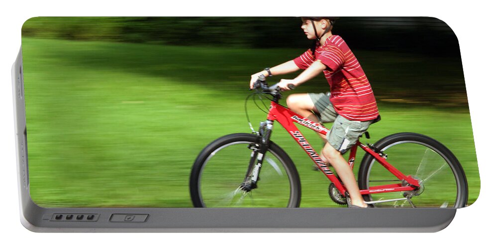 Boy Portable Battery Charger featuring the photograph Boy On Bike by Ted Kinsman