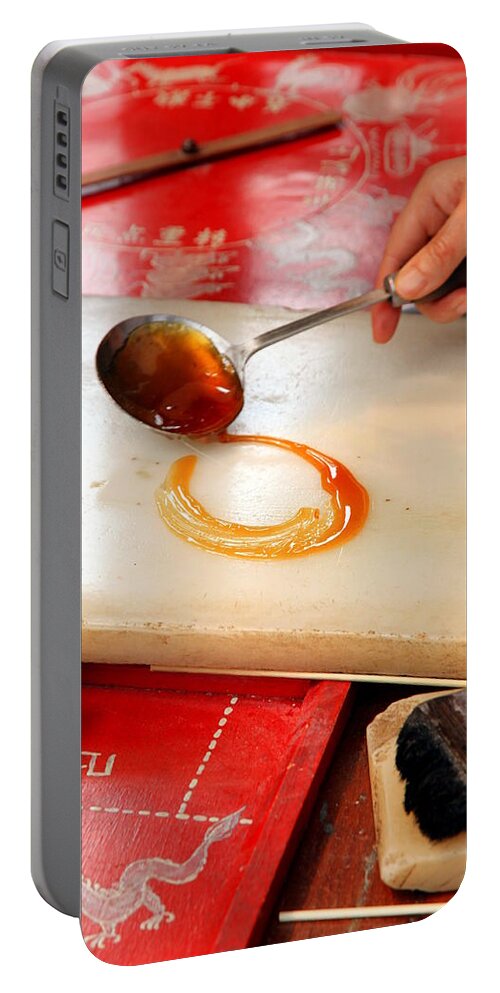 Food Portable Battery Charger featuring the photograph Candy Making by Valentino Visentini