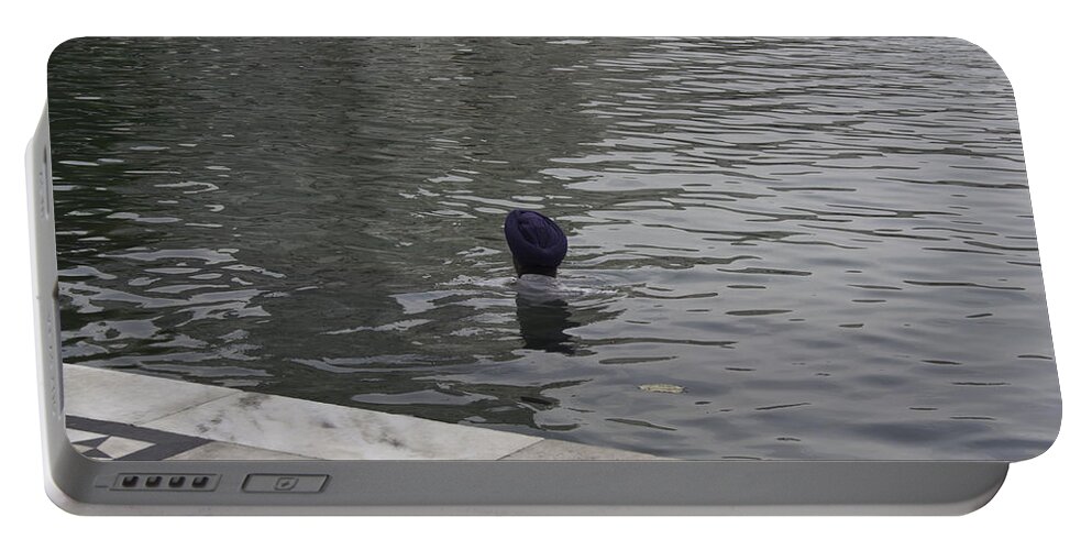 Amritsar Portable Battery Charger featuring the photograph Cleaning the sarovar in the Golden Temple by Ashish Agarwal