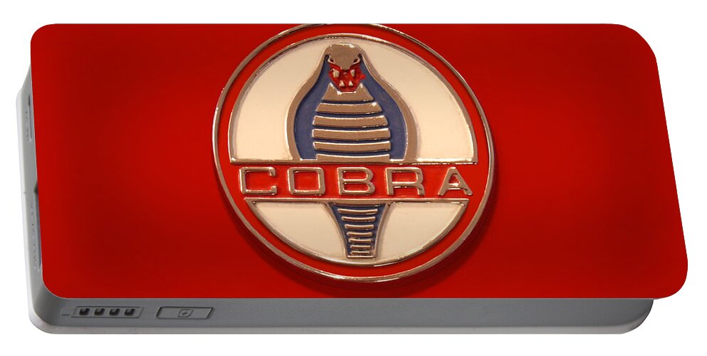 Transportation Portable Battery Charger featuring the photograph COBRA Emblem by Mike McGlothlen