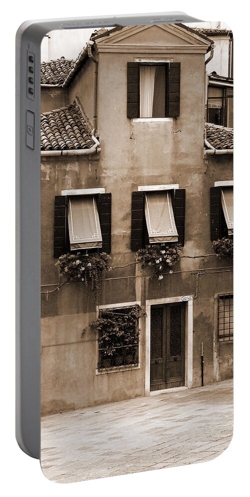 Sepia Portable Battery Charger featuring the photograph Courtyard by The Canal 2 by Donna Corless