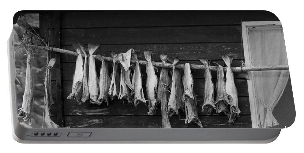 Fish Portable Battery Charger featuring the photograph Dried Cod on a Line by Heiko Koehrer-Wagner