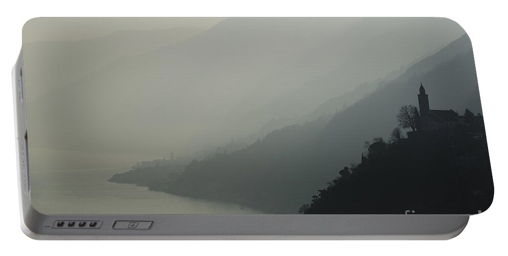 Church Portable Battery Charger featuring the photograph Foggy mountain by Mats Silvan