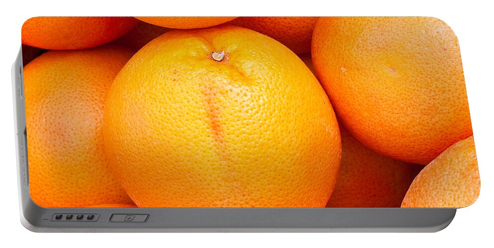 Background Portable Battery Charger featuring the photograph Grapefruit by Tom Gowanlock