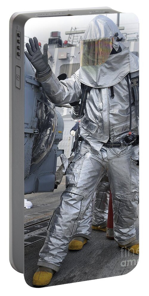 Military Portable Battery Charger featuring the photograph Hull Maintenance Technician Checks An by Stocktrek Images