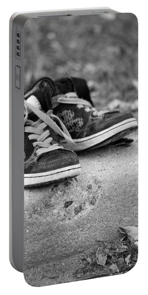 Sneakers Portable Battery Charger featuring the photograph Left On The Curb BW by Karol Livote