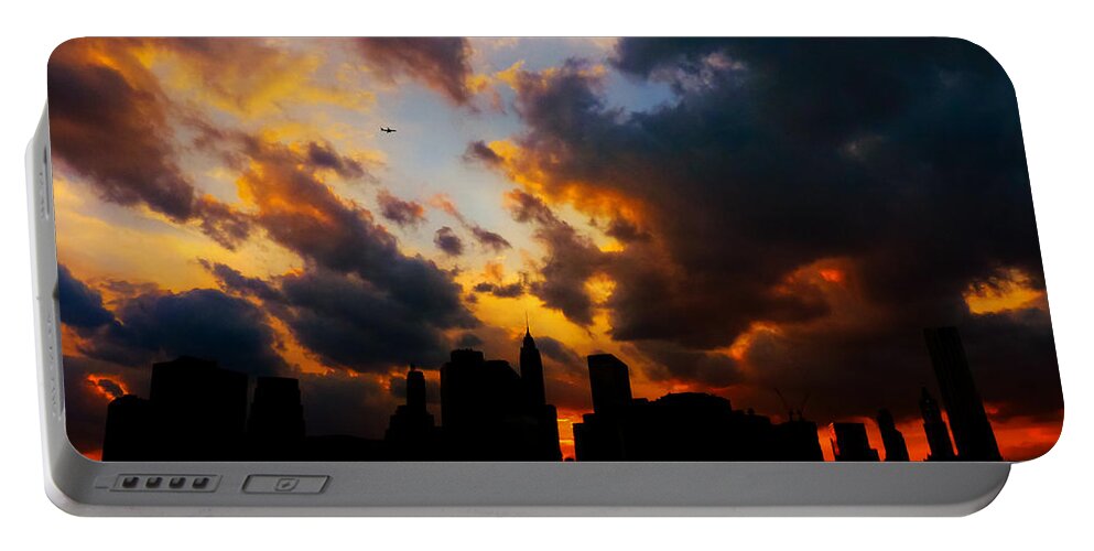 New York City Portable Battery Charger featuring the photograph New York City Skyline at Sunset Under Clouds by Vivienne Gucwa