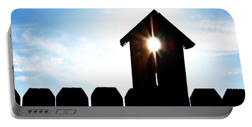 Birdhouse Portable Battery Charger featuring the photograph Peeking Sunlight through a Birdhouse by Charles Benavidez