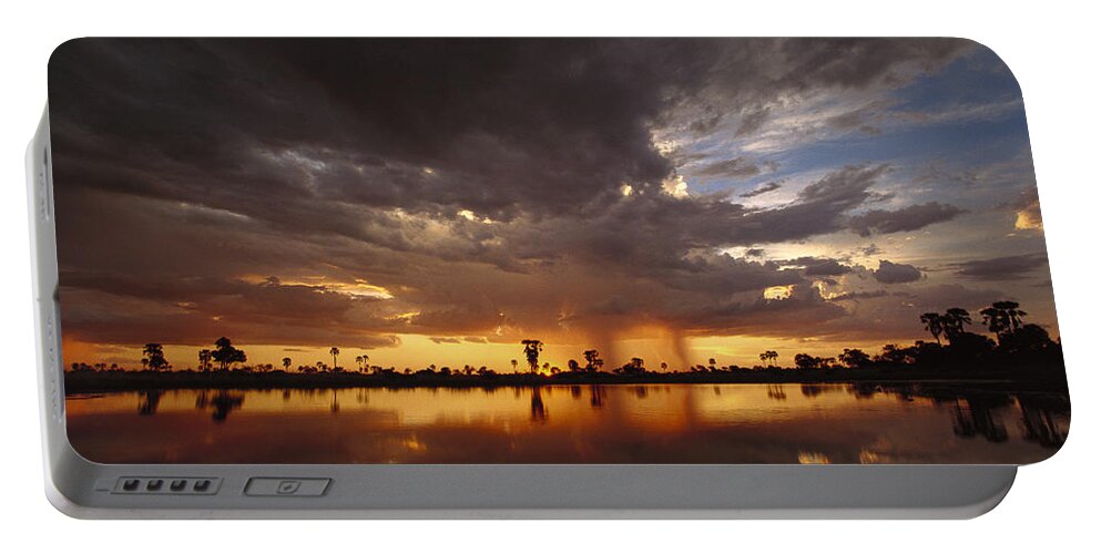 Mp Portable Battery Charger featuring the photograph Sunset And Storm Clouds Over Waterhole by Gerry Ellis