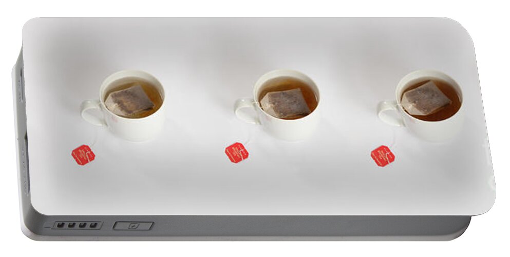Beverage Portable Battery Charger featuring the photograph Tea Steeping by Photo Researchers, Inc.