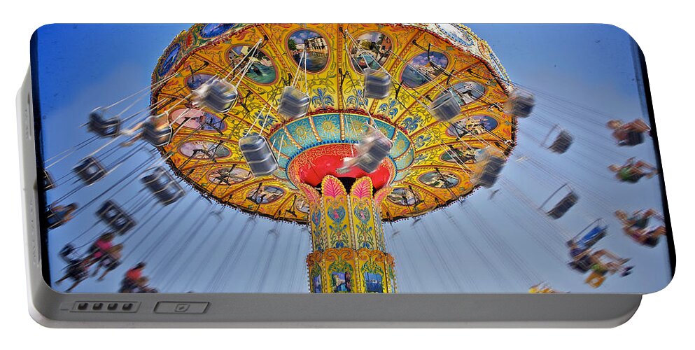 Air Portable Battery Charger featuring the photograph The Carnival Swings by Jarrod Erbe