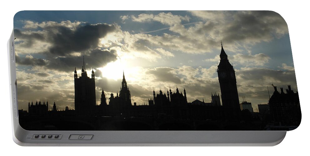 London Portable Battery Charger featuring the photograph The outline of Big Ben and Westminster and other buildings at sunset by Ashish Agarwal