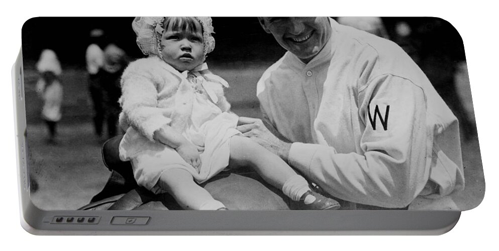 walter Johnson Portable Battery Charger featuring the photograph Walter Johnson holding a baby - c 1924 by International Images