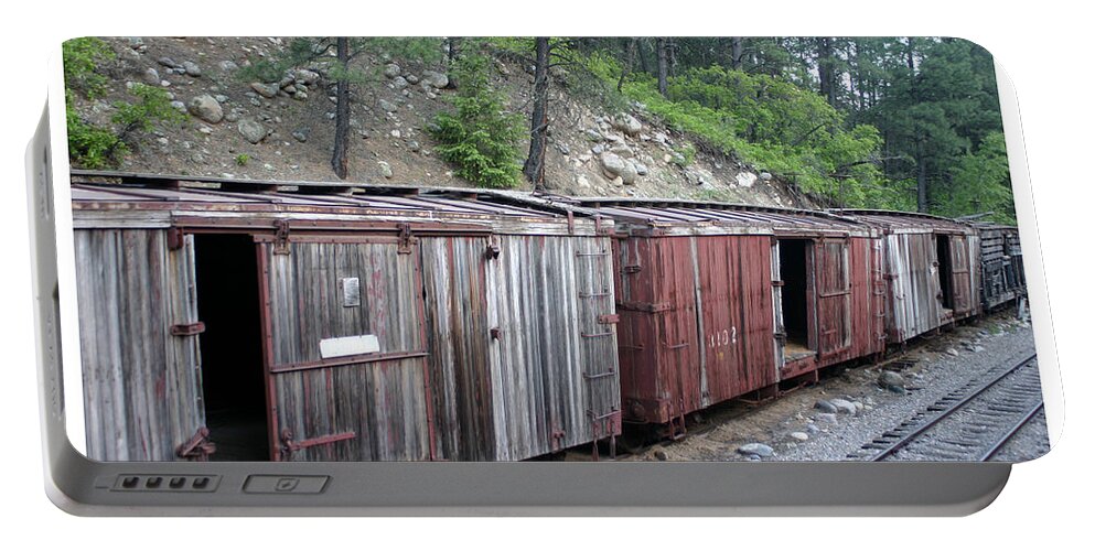 Textured Boxcars Of The Durango-silverton Steam Train Portable Battery Charger featuring the photograph Weathered box cars by Jack Pumphrey