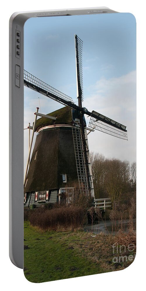 Amsterdam Portable Battery Charger featuring the digital art Windmill in Amsterdam by Carol Ailles