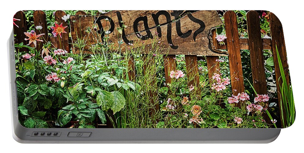 Plants Portable Battery Charger featuring the photograph Wooden plant sign in flowers by Simon Bratt