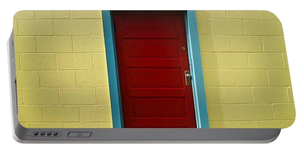 Aqua Portable Battery Charger featuring the photograph Yellow Wall and Red Door by Ray Laskowitz