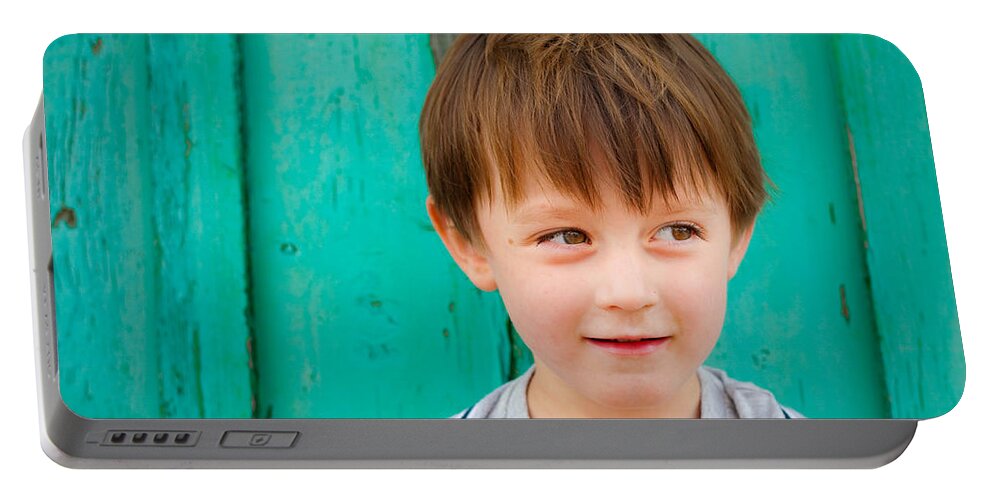 Adorable Portable Battery Charger featuring the photograph Young child by Tom Gowanlock