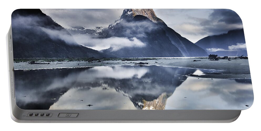 00438708 Portable Battery Charger featuring the photograph Mitre Peak Reflecting In Milford Sound #1 by Colin Monteath
