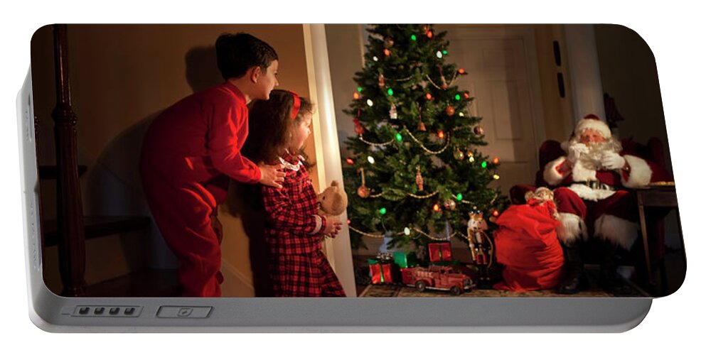 Christmas Portable Battery Charger featuring the photograph Peeking at Santa #1 by Diane Diederich