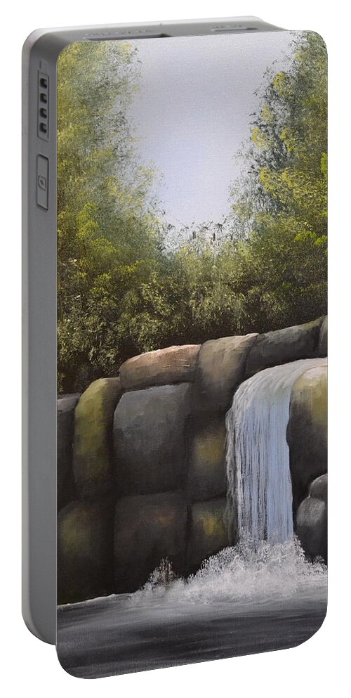A Painting Of A Waterfalls In A Forest With Large Boulders. There Is A Blue Cloudless Sky And The Forest Trees Have Very Dense Green Leaves. The Large Boulders Are Different Colors And The Small Lake Water Is Dark In Color. Portable Battery Charger featuring the painting Rocky Falls #2 by Martin Schmidt
