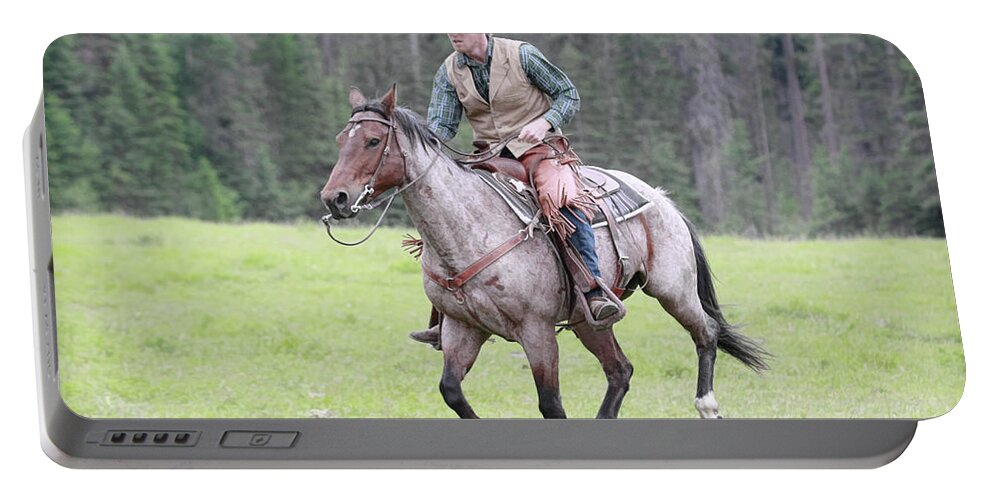 Cowboy Portable Battery Charger featuring the photograph The Rider #1 by Steve McKinzie