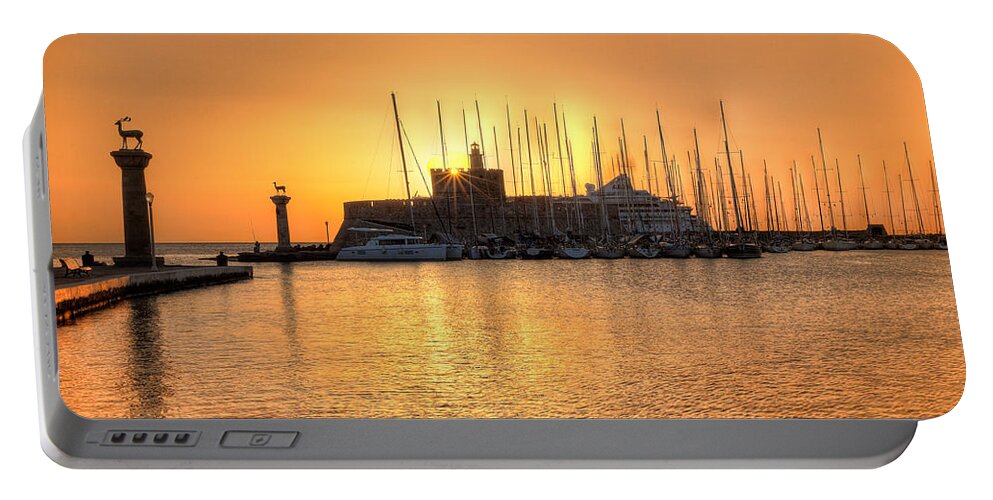 Aegean Portable Battery Charger featuring the photograph The sunrise at the old port of Rhodes - Greece #1 by Constantinos Iliopoulos