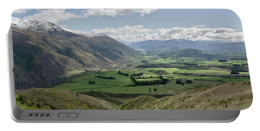 Valleys And Meadows Of New Zealand. Springtime. Queenstown Area. Portable Battery Charger featuring the photograph Valleys and Meadows of New Zealand. Springtime. Queenstown area. #1 by Yurix Sardinelly