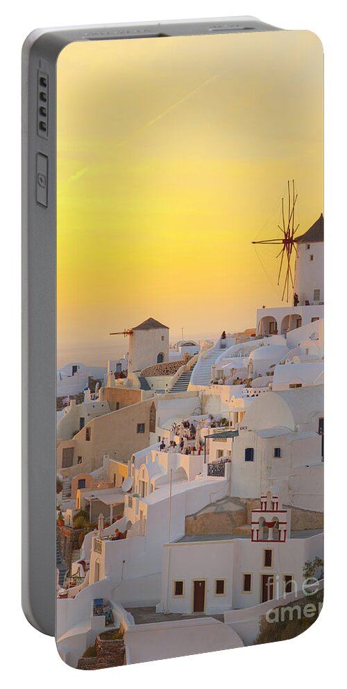 Santorini Portable Battery Charger featuring the photograph Windmill of Oia on Santorini by Anastasy Yarmolovich