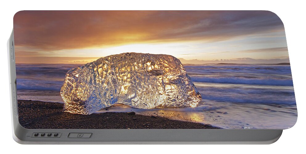 Translucent Portable Battery Charger featuring the photograph Ice washed ashore by Arterra Picture Library