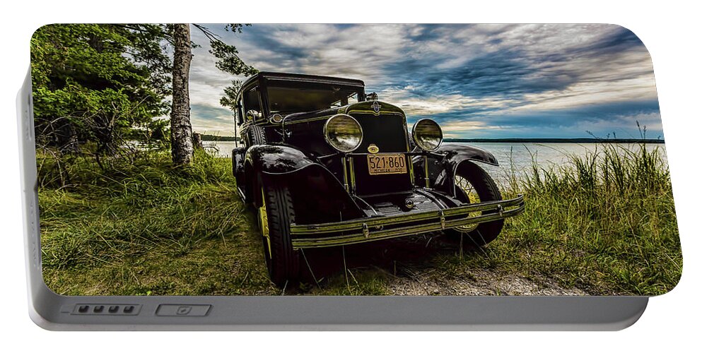 Higgins Lake Portable Battery Charger featuring the photograph 1930 Chevy on the shore of Higgins Lake by Joe Holley