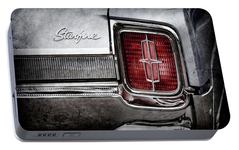 1965 Oldsmobile Starfire Taillight Emblem Portable Battery Charger featuring the photograph 1965 Oldsmobile Starfire Taillight Emblem -0212ac by Jill Reger