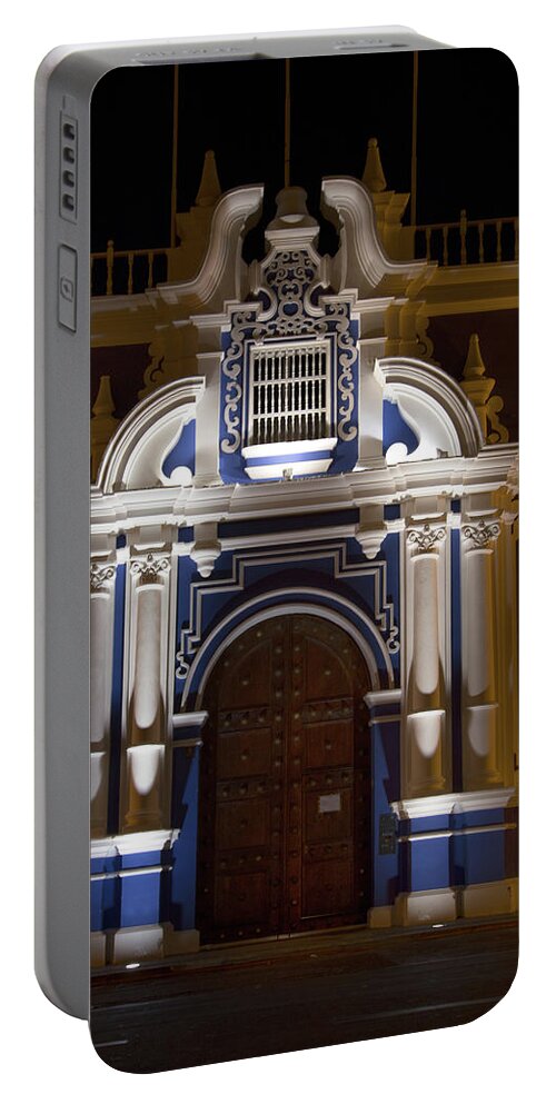 At Night Portable Battery Charger featuring the digital art Trjillo Plaza de Armas at night #7 by Carol Ailles