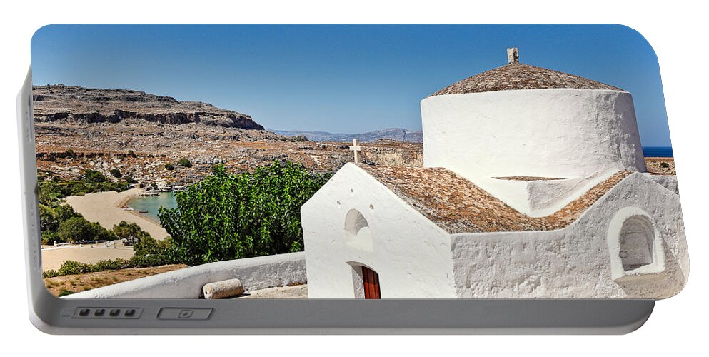 Chapel Portable Battery Charger featuring the photograph A chapel in the village of Lindos in Rhodes - Greece. by Constantinos Iliopoulos