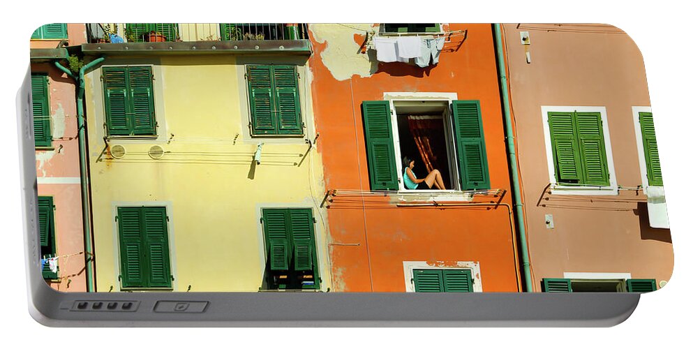 Cinque Terre Portable Battery Charger featuring the photograph A girl on a window sill, Italy by Aashish Vaidya